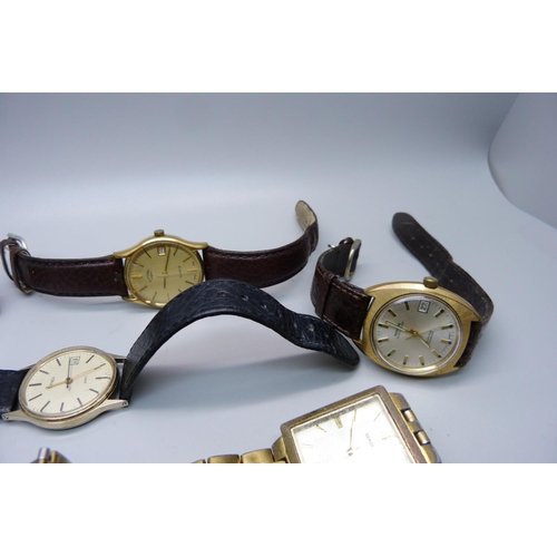 932 - A collection of gentleman's wristwatches