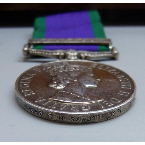 944 - A carved wooden box, a military beret with cap badge, other badges and a For Campaign Service medal ... 