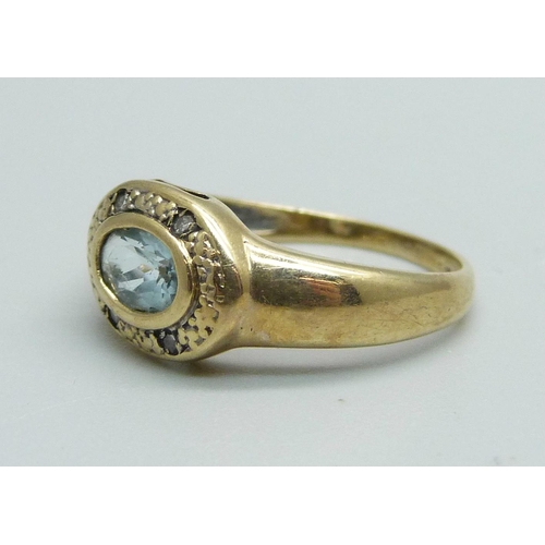 949 - A 9ct gold, blue stone and diamond ring, 1.8g, J