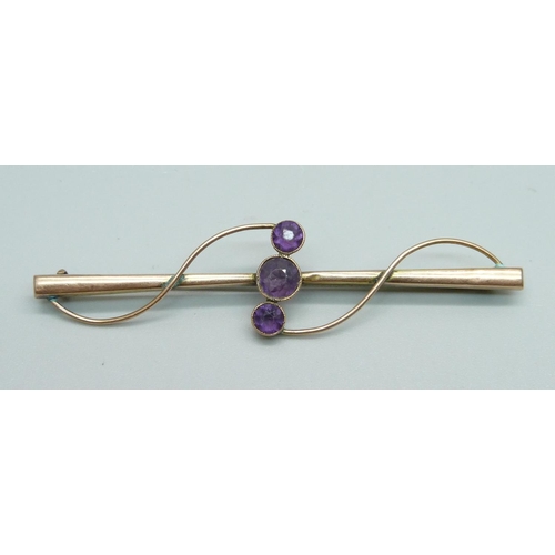 950 - A 9ct gold and three stone amethyst brooch, 3.9g, 76mm