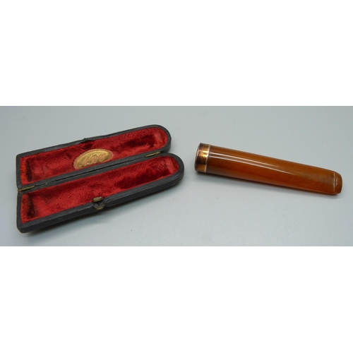 954 - A 9ct gold and amber cigarette holder, Birmingham 1908, in original case