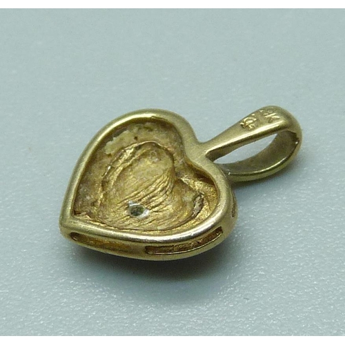 974 - A small 9ct gold and diamond heart shaped pendant, 0.9g