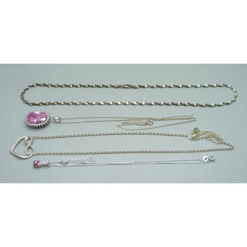 977 - Three silver pendants and chains and a silver necklet