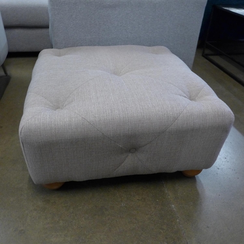 1323 - An oatmeal textured weave buttoned footstool