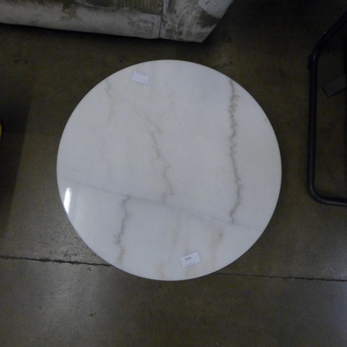 1334 - A circular marble top coffee table