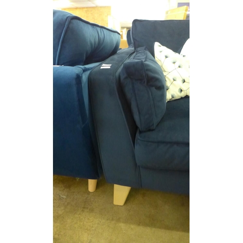 1431 - A Barker and Stonehouse deep blue velvet three seater sofa with patterned scatter cushions