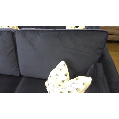 1431 - A Barker and Stonehouse deep blue velvet three seater sofa with patterned scatter cushions