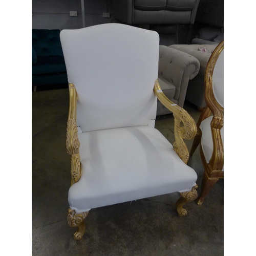 1443 - A pair of gold painted and white leather effect King and Queen chairs