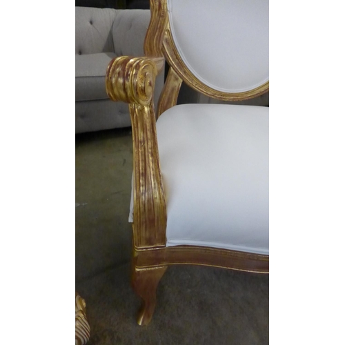 1443 - A pair of gold painted and white leather effect King and Queen chairs