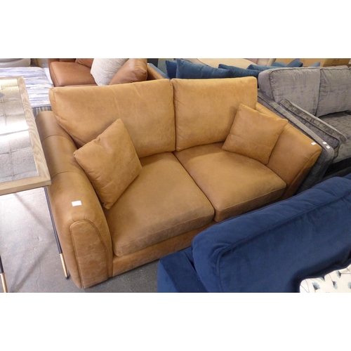 1496 - A tan vegan leather 2.5 seater sofa