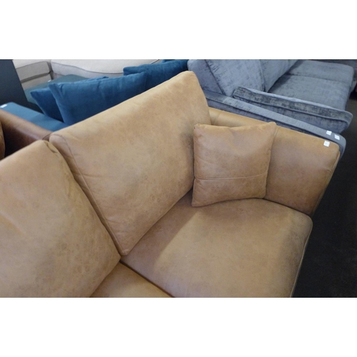 1496 - A tan vegan leather 2.5 seater sofa