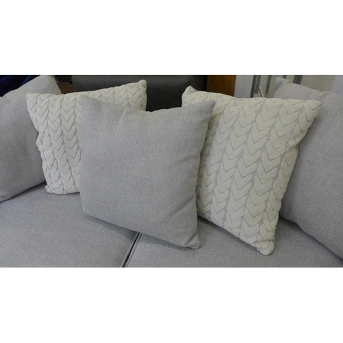 1506 - A grey textured weave upholstered three seater, RHF/LHF sofa/chaise with patterned scatter cushions