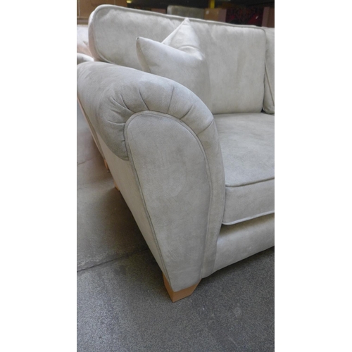 1564 - A pair of champagne velvet upholstered three seater sofas