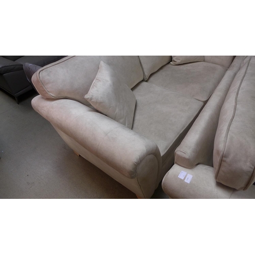 1564 - A pair of champagne velvet upholstered three seater sofas