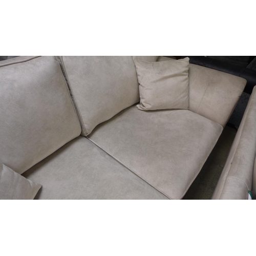 1564 - A pair of champagne velvet upholstered three seater sofas