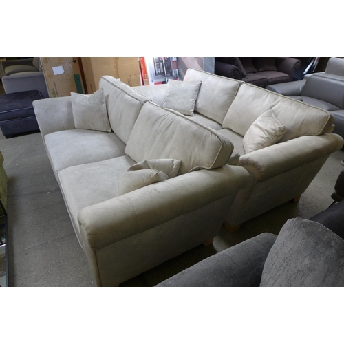 1564 - A pair of champagne velvet upholstered three seater sofas