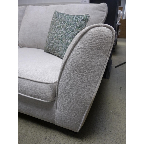 1570 - A Bone upholstered three seater sofa with green patterened scatter cushions