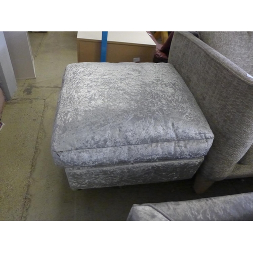 1586 - A silver crushed velvet three seater sofa and footstool