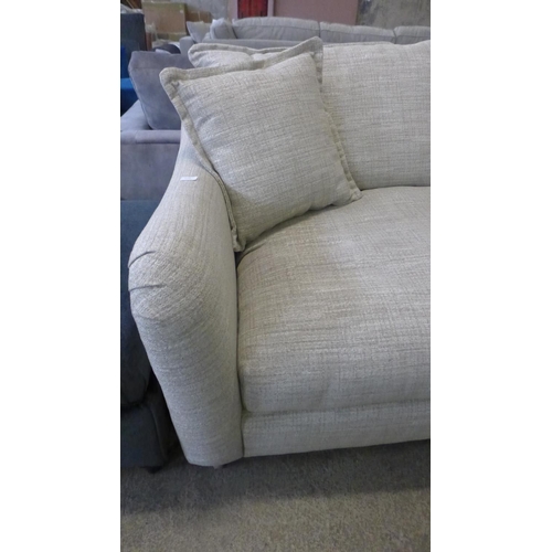 1588 - A champagne upholstered four seater sofa