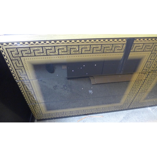 1594 - A black and gold high gloss Greek key six drawer chest - Damaged