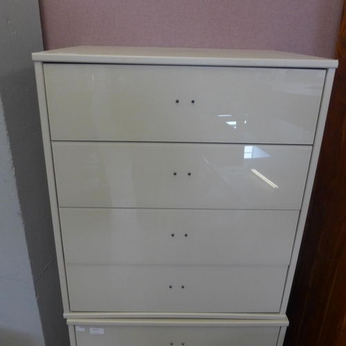 1617 - A white painted high glass four drawer chest * this lot is subject to VAT