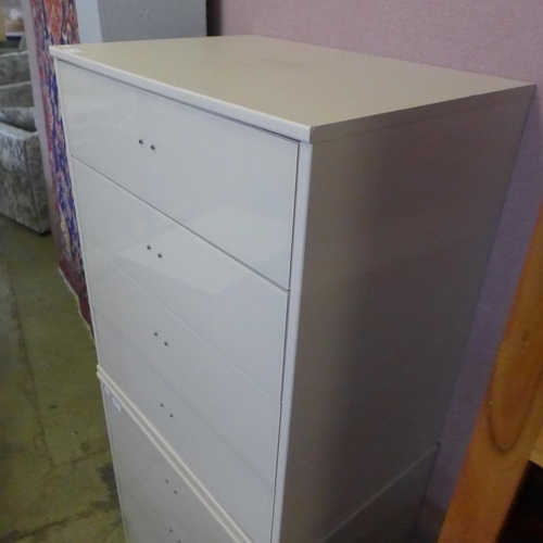 1617 - A white painted high glass four drawer chest * this lot is subject to VAT