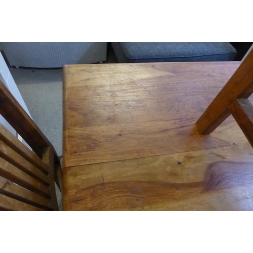 1622 - An Indian hardwood fixed top dining table with a set of six cream upholstered dining chairs