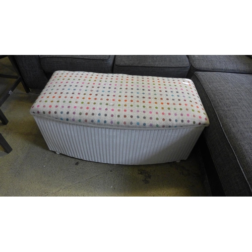 1624 - A white painted and upholstered Lloyd Loom blanket box