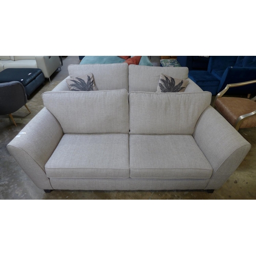 1446 - A pair of champagne textured weave, three seater sofas with palm leaf scatter cushions