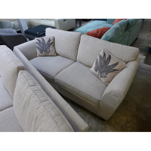 1446 - A pair of champagne textured weave, three seater sofas with palm leaf scatter cushions