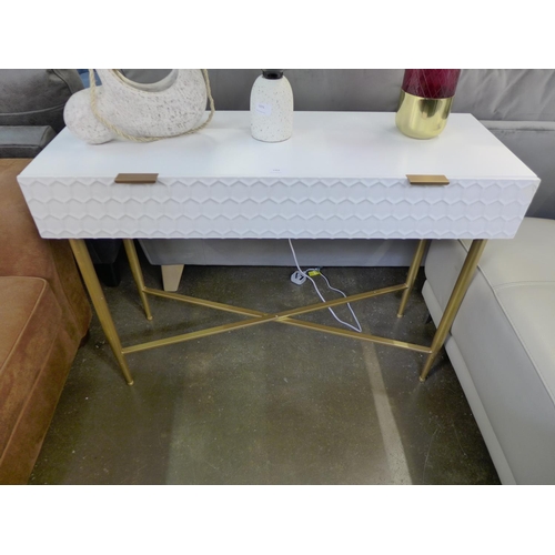 1454 - A white console table with gold legs