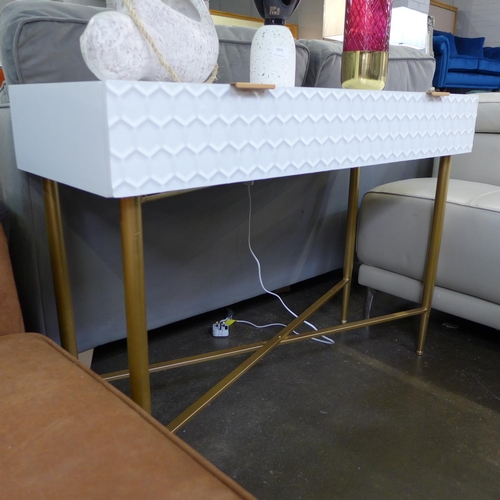 1454 - A white console table with gold legs