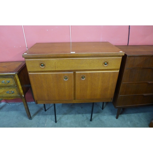 79 - A teak cabinet on black metal stand