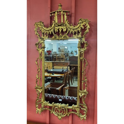 1 - A Chinese Chippendale style pagoda topped gilt framed mirror