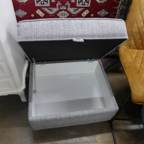 1412 - A grey upholstered ottoman footstool