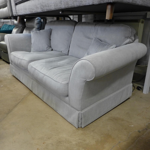 1415 - A fossil grey upholstered three seater sofa