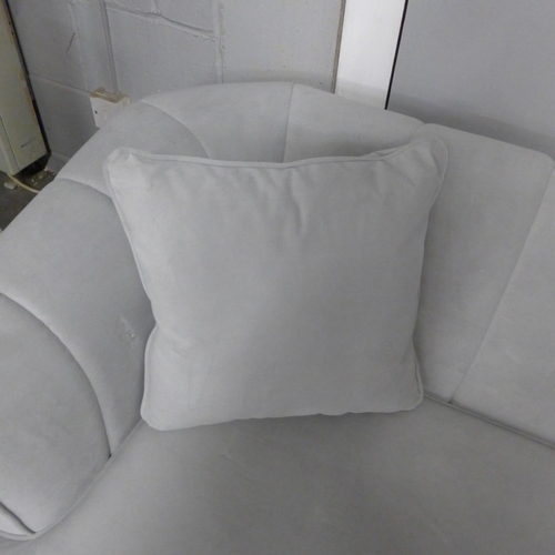 1422 - A grey velvet upholstered shell back two seater sofa