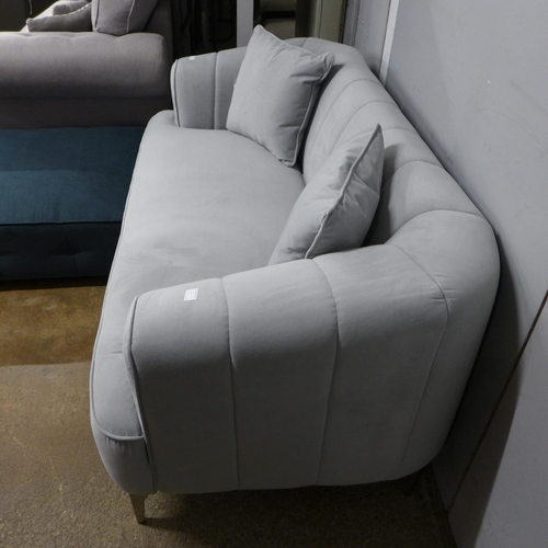 1422 - A grey velvet upholstered shell back two seater sofa