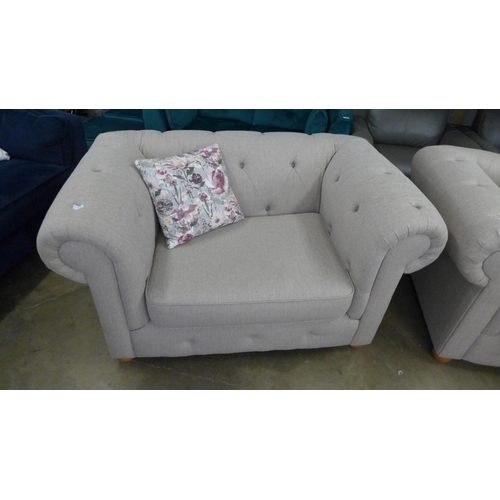 1442 - A taupe textured weave Chesterfield style three seater sofa and love seat with patterned scatter cus... 