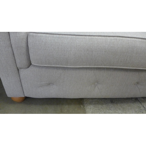 1442 - A taupe textured weave Chesterfield style three seater sofa and love seat with patterned scatter cus... 