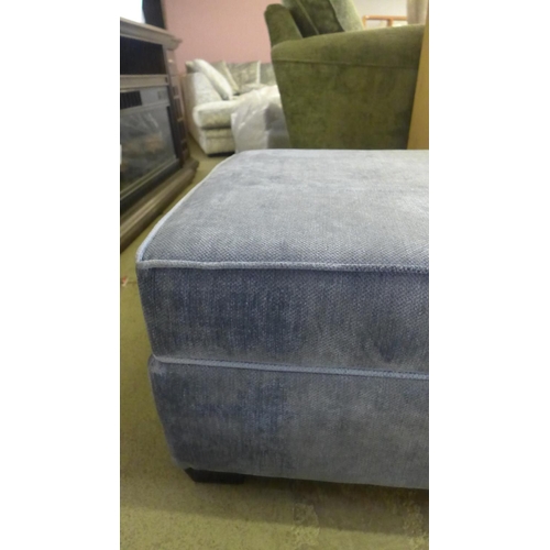 1556 - A blue upholstered ottoman footstool