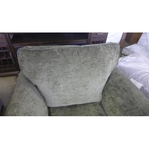 1580 - A moss green upholstered armchair