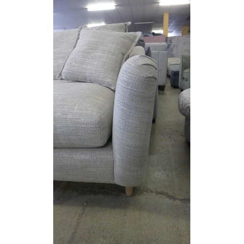 1588 - A champagne upholstered four seater sofa