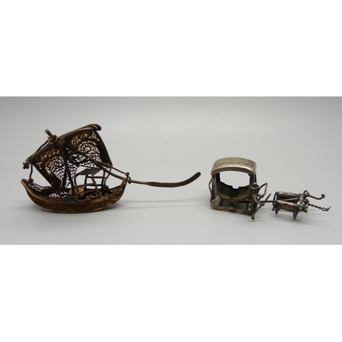 1012 - A miniature white metal carriage and an oriental filigree boat