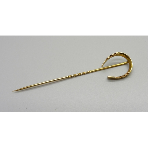 1024 - An 18ct gold horseshoe stick pin, 3.5g