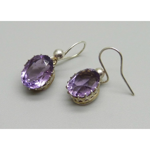 1035 - A pair of amethyst drop earrings, (test as silver)