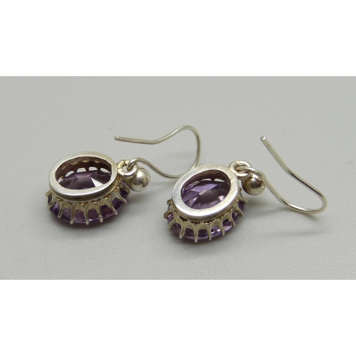 1035 - A pair of amethyst drop earrings, (test as silver)