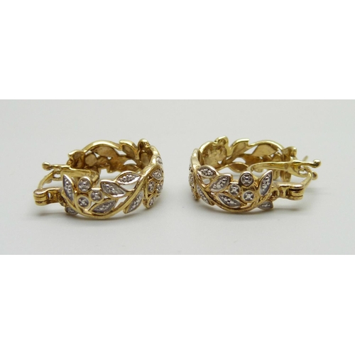 1047 - A pair of silver gilt earrings