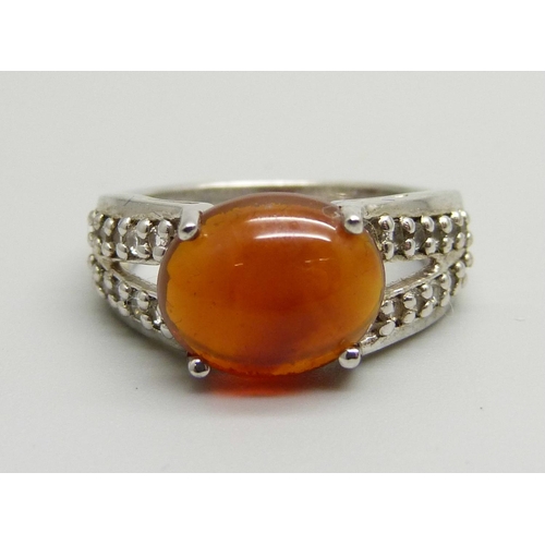 1083 - A silver American fire opal and white topaz ring, L, with certificate