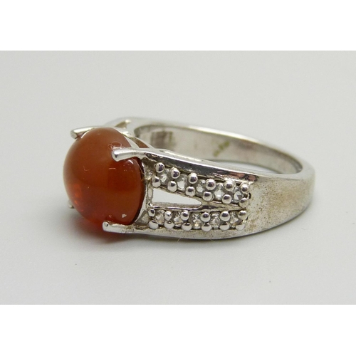 1083 - A silver American fire opal and white topaz ring, L, with certificate